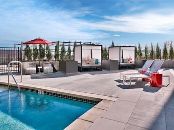 The stack resort style swimming pool with cabanas